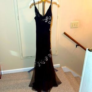 Xscape dress. Black with embroidery and bead accent. Size 12. Spaghetti strap.